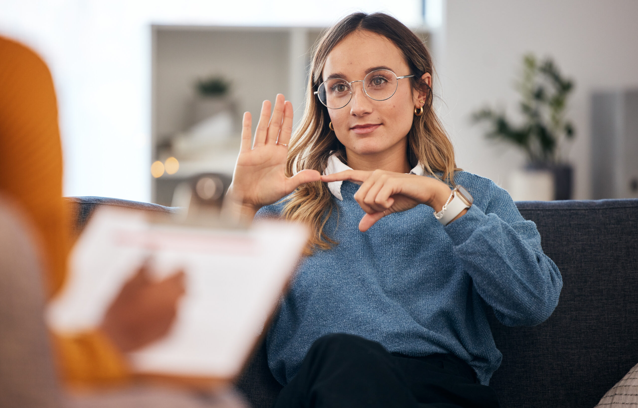 Adult discussing communication strategies with a speech therapist